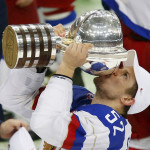 Russia’s Shirokov kisses the trophy as he celebrates winning their men’s ice hockey World Championship final game against Finland at Minsk Arena in Minsk